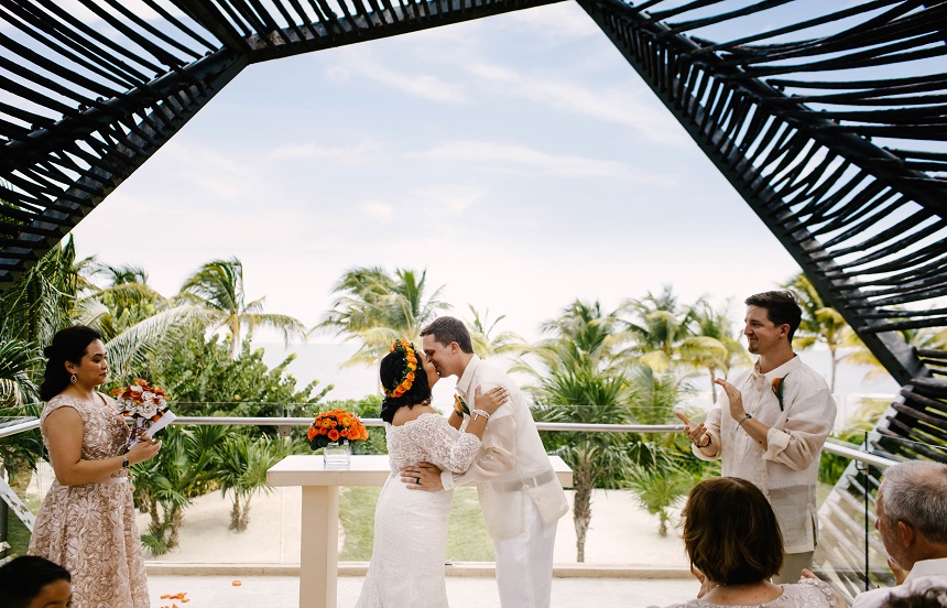 bride and groom first kiss