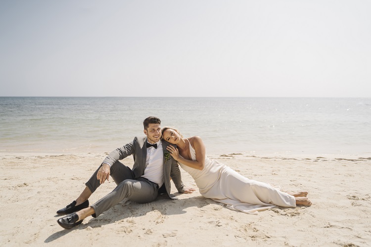 Bride and groom on beach