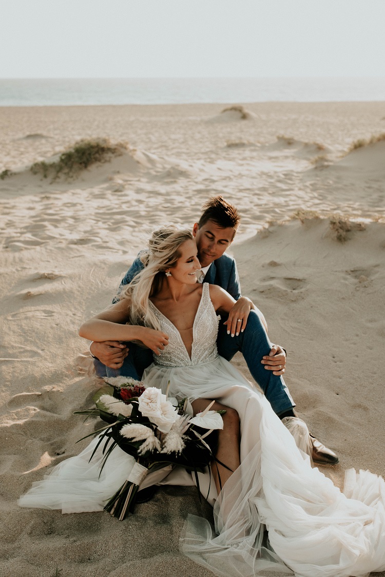 bride and groom on the beach