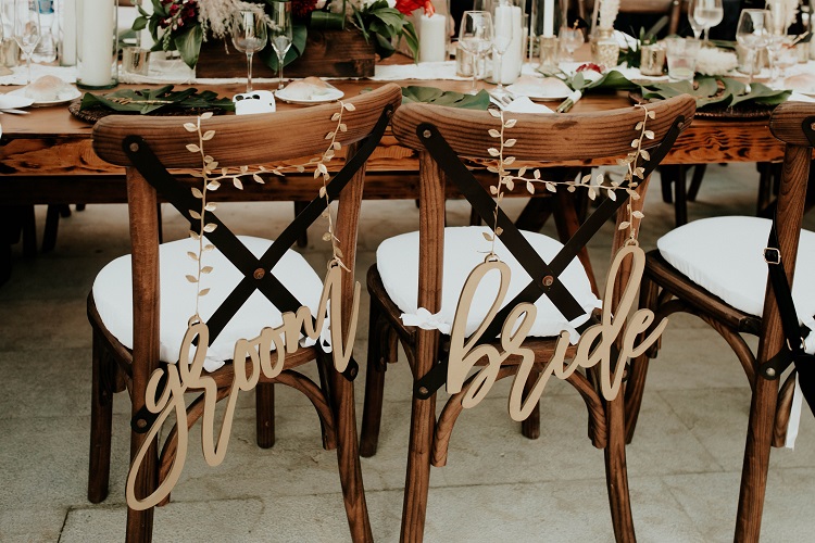 bride and groom chair signs