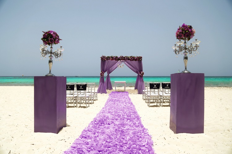 purple beach wedding ceremony