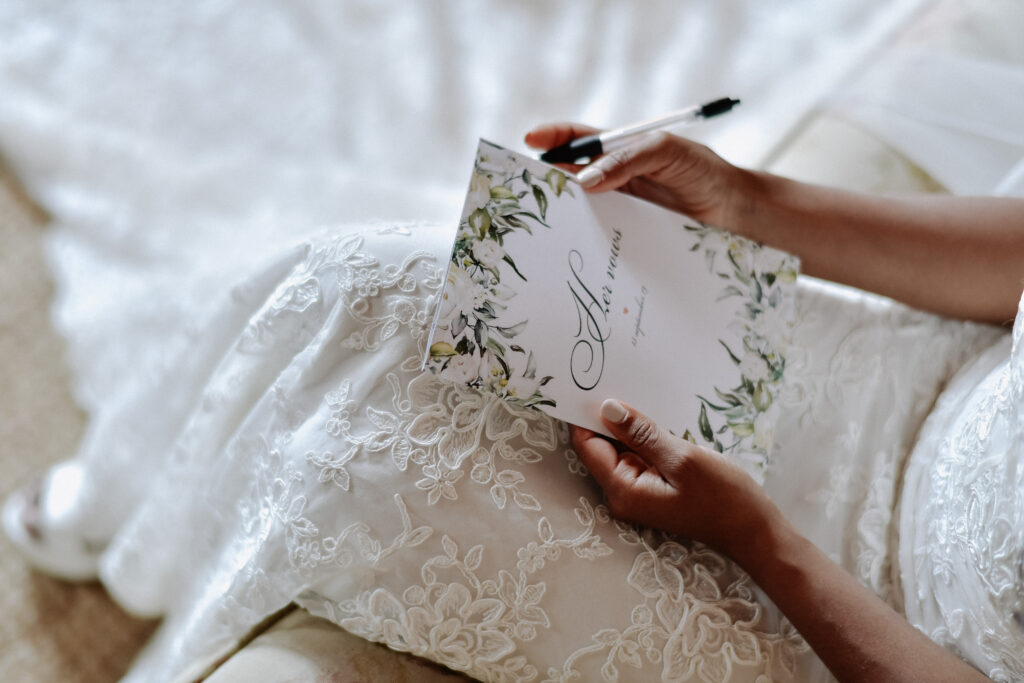 wedding rsvp ; Bride is writing the wedding vows , wedding day symbols