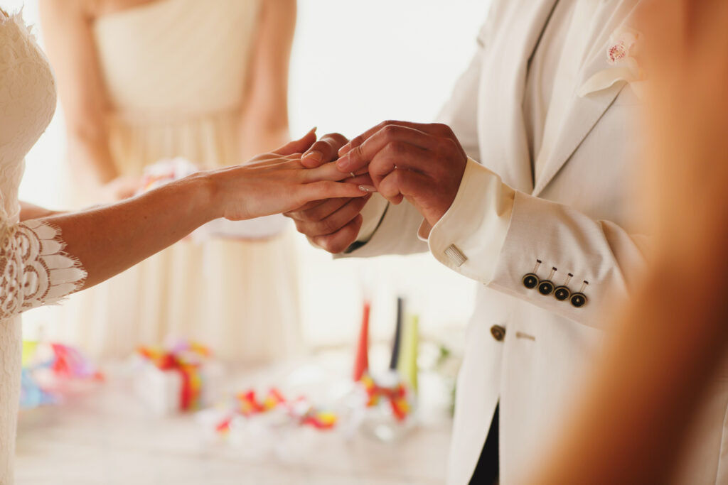 Beautiful,Gorgeous,Blonde,Bride,With,Orchids,And,Stylish,Groom,Putting