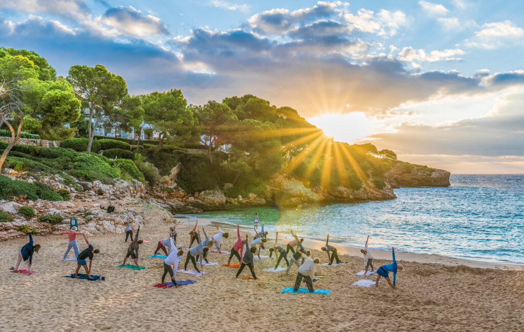 People,Practicing,Yoga,At,Sunset,Time,In,Palma,Mallorca,Island,